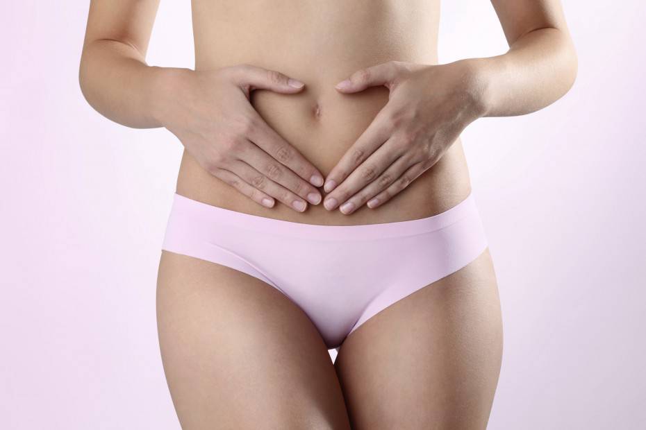 Woman's hands on stomach