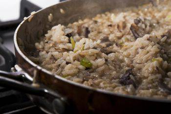 Close-up of mushroom risotto cooking on a stove